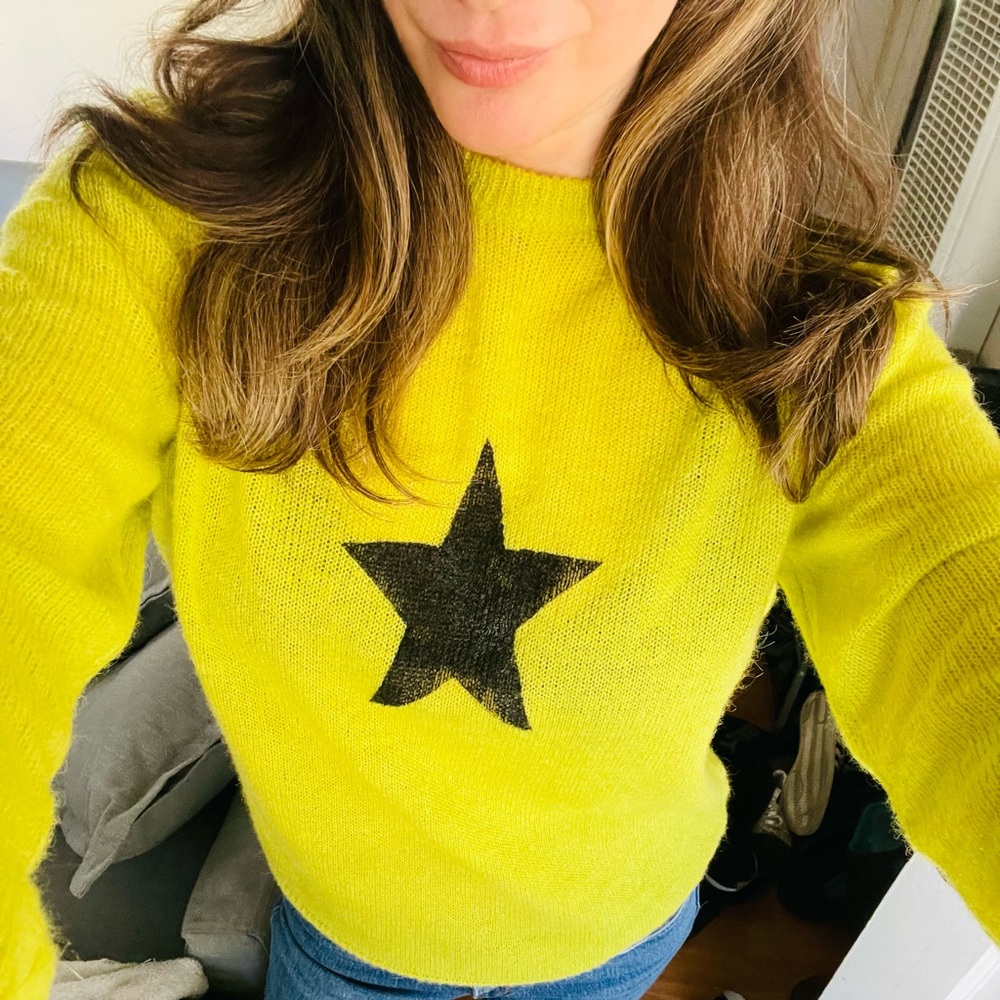 Green sweater. I hand painted the black star on it.